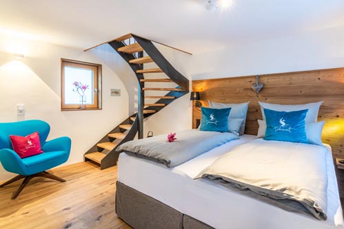 Ferienwohnung Seeheimat | Schlafzimmer mit Wendeltreppe